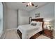 Comfortable bedroom with closet, light gray walls, carpet and natural light at 16420 Iola Woods Trl, Dade City, FL 33523