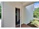This home features a brick-lined entry and door that leads directly from the garage into the house at 16420 Iola Woods Trl, Dade City, FL 33523
