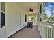 Relax on this screened porch that offers outdoor dining, a ceiling fan, and views of nature at 16420 Iola Woods Trl, Dade City, FL 33523