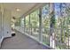 This is a view of the home's expansive screened in porch that wraps around the side of the house at 16420 Iola Woods Trl, Dade City, FL 33523