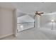 Lofted upstairs landing with a fan and lots of natural light at 16420 Iola Woods Trl, Dade City, FL 33523