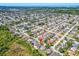 An aerial view showing the home's position within a well-developed residential community at 1650 Springdale Dr, Holiday, FL 34691