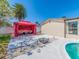 Relaxing backyard with a pool, gazebo, and lounging area at 1650 Springdale Dr, Holiday, FL 34691