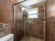 Bathroom featuring a frameless shower with tiled walls at 1650 Springdale Dr, Holiday, FL 34691