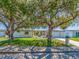 Charming single-story home with a well-manicured lawn and mature trees providing ample shade at 1650 Springdale Dr, Holiday, FL 34691