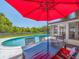 Outdoor dining area with a view of the pool at 1650 Springdale Dr, Holiday, FL 34691