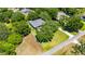 Aerial view showcasing the property's well-manicured lawn, mature trees, and desirable location at 1806 Chickasaw Trl, Valrico, FL 33596