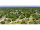 Scenic aerial image captures the serene neighborhood with tree-lined streets and a charming home at 1806 Chickasaw Trl, Valrico, FL 33596