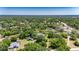 High-angle shot of the home, highlighting its tranquil wooded setting and spacious lot in a residential area at 1806 Chickasaw Trl, Valrico, FL 33596