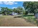 Large backyard with a storage shed and carport offering outdoor space and functionality at 1806 Chickasaw Trl, Valrico, FL 33596