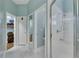 Bright bathroom with glass shower, and walk-in closet offers ample space for all your storage needs at 1806 Chickasaw Trl, Valrico, FL 33596