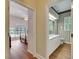 Bathroom with wallpaper, shuttered window, and white vanity at 1806 Chickasaw Trl, Valrico, FL 33596