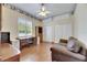 Bedroom with built-in shelves, a desk, and a cozy seating area at 1806 Chickasaw Trl, Valrico, FL 33596