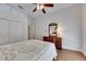 Bedroom with ceiling fan and wooden furniture at 1806 Chickasaw Trl, Valrico, FL 33596