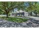 Stylish single-story home with attached garage and meticulously landscaped front yard at 1806 Chickasaw Trl, Valrico, FL 33596