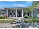 Welcoming home exterior featuring a well-maintained lawn and symmetrical landscaping at 1806 Chickasaw Trl, Valrico, FL 33596