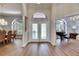 Grand foyer with double doors leading to elegant living spaces at 1806 Chickasaw Trl, Valrico, FL 33596