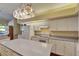 Spacious kitchen with bright cabinets, plentiful counter space and center island at 1806 Chickasaw Trl, Valrico, FL 33596