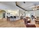 Bright and inviting living room with wood floors and seamless transition to the kitchen and dining areas at 1806 Chickasaw Trl, Valrico, FL 33596