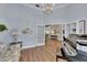Inviting living room with a grand piano and views into other rooms at 1806 Chickasaw Trl, Valrico, FL 33596