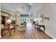 Open living room with brick fireplace, wood floors, and views to the backyard at 1806 Chickasaw Trl, Valrico, FL 33596