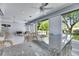 Sunroom featuring granite bar, tiled floors, wicker furnishings, and panoramic outdoor views at 1806 Chickasaw Trl, Valrico, FL 33596