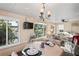 Cozy dining area with views of the canal through large windows at 200 Portree Dr, Dunedin, FL 34698