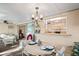 Inviting dining area with stylish chandelier and pass-through to living space at 200 Portree Dr, Dunedin, FL 34698