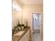 Bathroom featuring granite countertop vanity and bath/shower combo at 21794 Pristine Lake Blvd, Land O Lakes, FL 34637