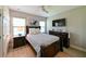 Comfortable bedroom features a ceiling fan, wooden furniture, and plenty of natural light at 21794 Pristine Lake Blvd, Land O Lakes, FL 34637