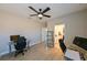 Bedroom with ceiling fan, laminated floors, a glass desk and modern chair at 21794 Pristine Lake Blvd, Land O Lakes, FL 34637