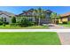 Charming two-story home with well-manicured landscaping, a beautiful facade and attached garage at 21794 Pristine Lake Blvd, Land O Lakes, FL 34637