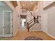 A grand foyer displays a wooden staircase and elegant decor, creating an inviting entrance at 21794 Pristine Lake Blvd, Land O Lakes, FL 34637