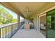 Large screened lanai offering relaxing outdoor seating arrangements and beautiful green views at 21794 Pristine Lake Blvd, Land O Lakes, FL 34637