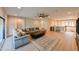 A cozy living room features a sectional sofa, a ceiling fan, and inviting ambiance at 21794 Pristine Lake Blvd, Land O Lakes, FL 34637