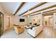 Open-concept living area with exposed beams, stylish furnishings, and plenty of natural light at 21794 Pristine Lake Blvd, Land O Lakes, FL 34637