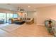 A spacious living room offers comfortable seating, a ceiling fan, and seamless outdoor access at 21794 Pristine Lake Blvd, Land O Lakes, FL 34637