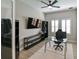 A well-lit office is furnished with a glass desk, a black chair, and plenty of storage at 21794 Pristine Lake Blvd, Land O Lakes, FL 34637