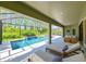 Covered patio boasts a gorgeous pool and spa with plenty of room for seating and relaxation at 21794 Pristine Lake Blvd, Land O Lakes, FL 34637