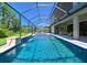 The long refreshing pool and a screened-in lanai is perfect for relaxation and entertainment at 21794 Pristine Lake Blvd, Land O Lakes, FL 34637