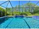 A sparkling pool with water features offers a serene and private backyard oasis at 21794 Pristine Lake Blvd, Land O Lakes, FL 34637