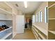 Spacious walk-in closet with custom shelves and wood floors, offering ample storage at 21794 Pristine Lake Blvd, Land O Lakes, FL 34637