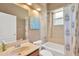 Well-lit bathroom with vanity, mirror, toilet, and shower-tub combo at 27054 Fordham Dr, Wesley Chapel, FL 33543