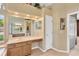 Bathroom featuring a sink, vanity area, and access to the walk in closet at 27054 Fordham Dr, Wesley Chapel, FL 33543