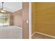 View of a bedroom from closet shows a sliding glass door that leads to private patio at 27054 Fordham Dr, Wesley Chapel, FL 33543