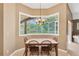 Bright dining area with natural light and a view of the backyard at 27054 Fordham Dr, Wesley Chapel, FL 33543