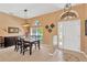 Welcoming entryway and dining area features decorative wall accents and modern lighting fixtures at 27054 Fordham Dr, Wesley Chapel, FL 33543