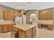 Spacious kitchen features an island, stainless steel appliances, and ample counter space for meal preparation at 27054 Fordham Dr, Wesley Chapel, FL 33543