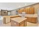 Open kitchen with an island, light countertops, and a seamless transition to living areas at 27054 Fordham Dr, Wesley Chapel, FL 33543