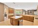 Bright, open kitchen with a central island, abundant counter space, and breakfast nook with bay windows at 27054 Fordham Dr, Wesley Chapel, FL 33543